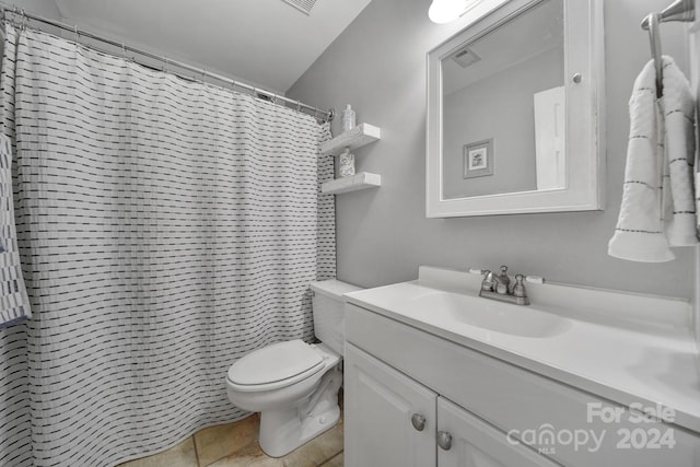 bathroom with a shower with shower curtain, vanity, toilet, and tile patterned flooring