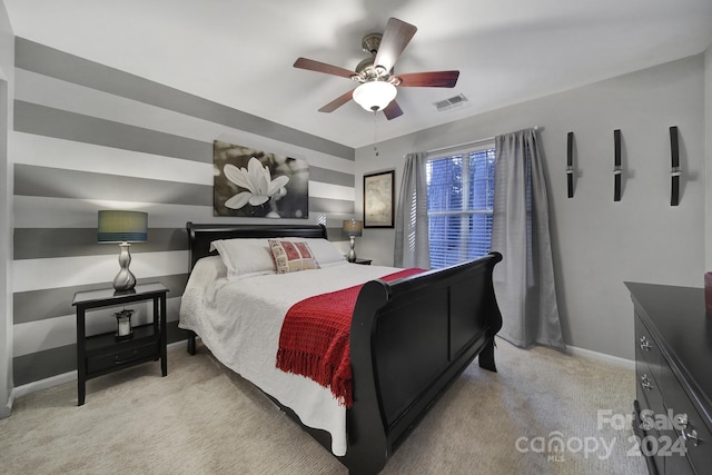 bedroom with light colored carpet and ceiling fan