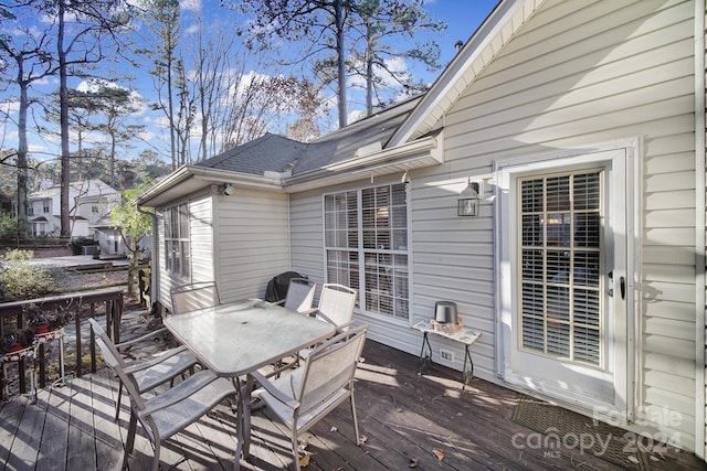 wooden deck featuring area for grilling