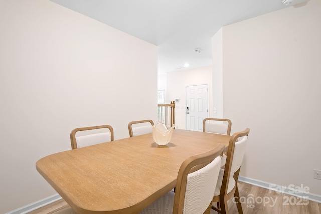 dining area featuring hardwood / wood-style flooring