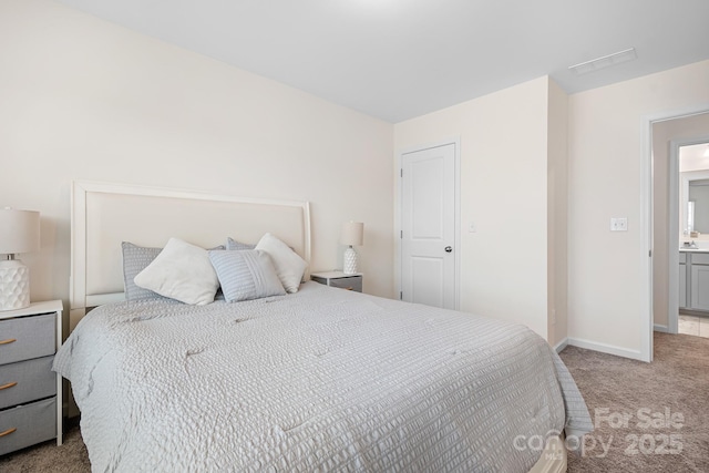 bedroom with light colored carpet