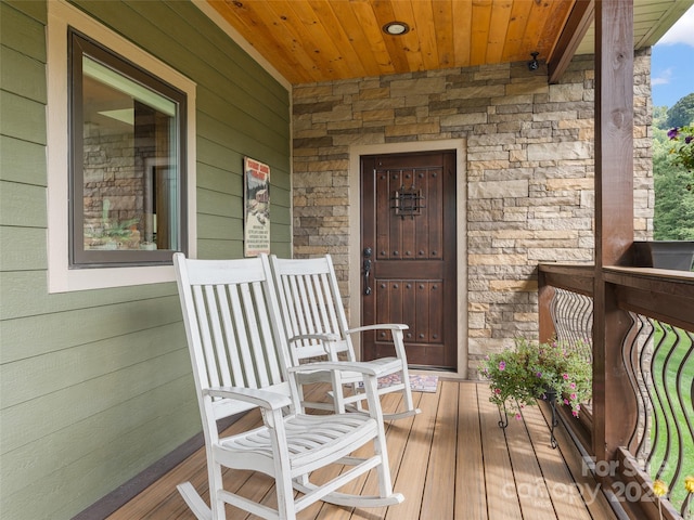 entrance to property featuring a porch