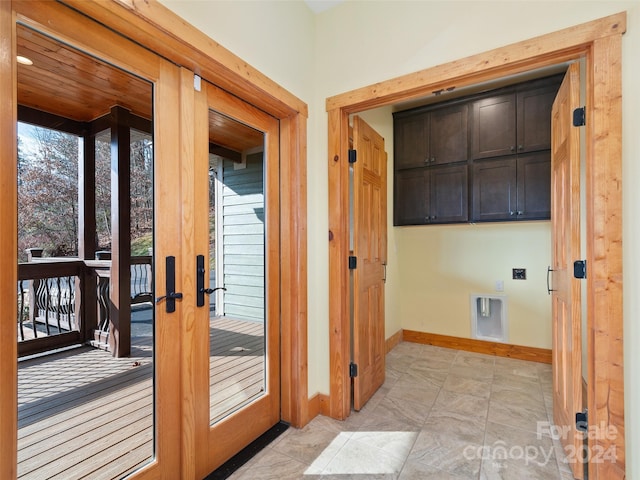 doorway with french doors and light tile patterned floors