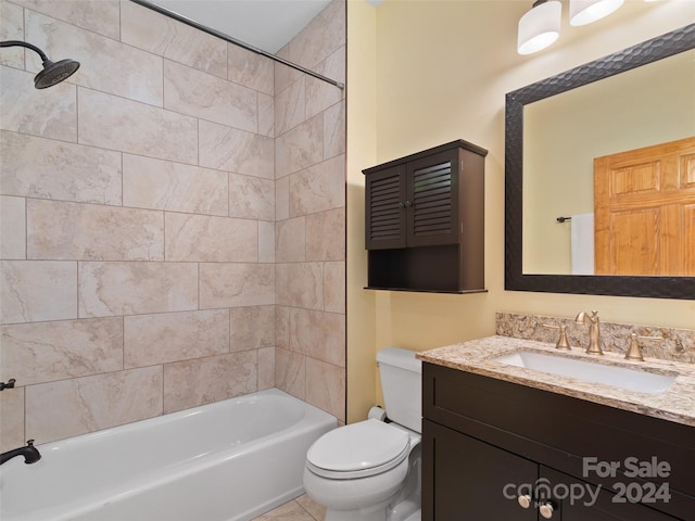 full bathroom featuring vanity, toilet, and tiled shower / bath