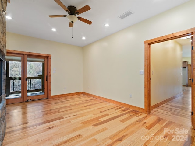 unfurnished room featuring light hardwood / wood-style floors and ceiling fan