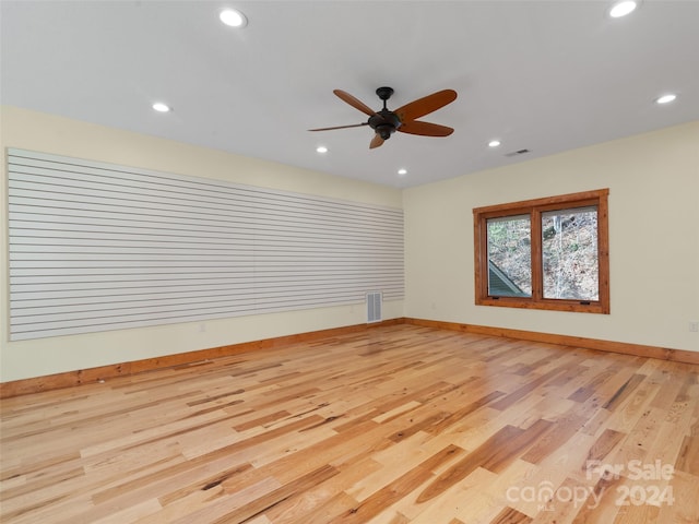 unfurnished room featuring light hardwood / wood-style flooring and ceiling fan