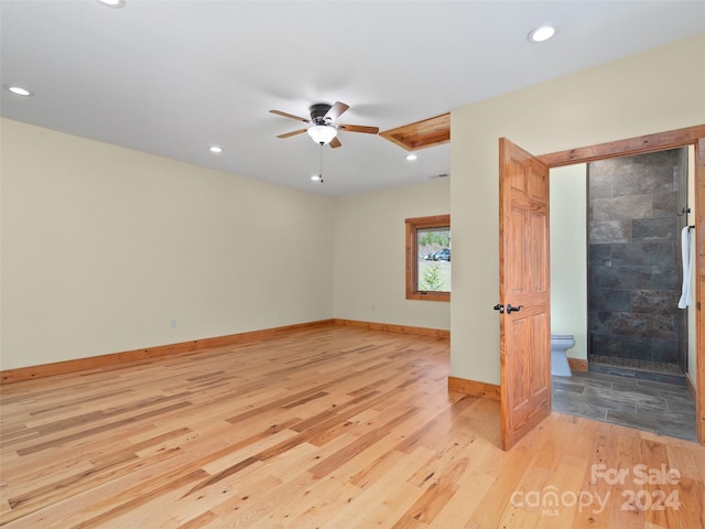 spare room featuring ceiling fan and light wood-type flooring