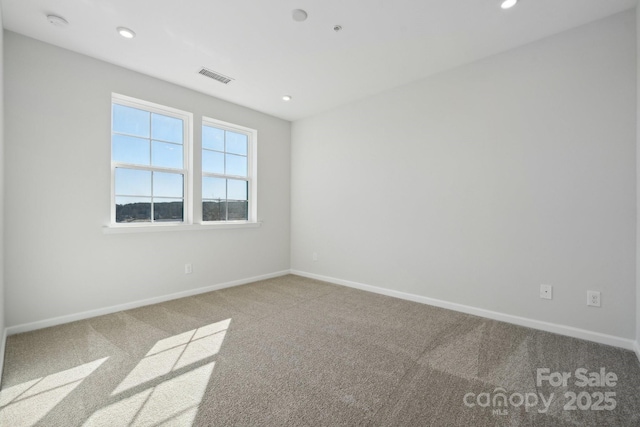 unfurnished room featuring carpet floors