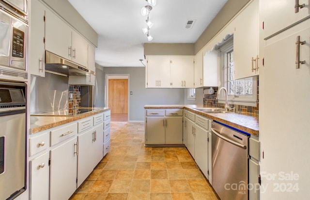 kitchen featuring white cabinetry, sink, and stainless steel appliances