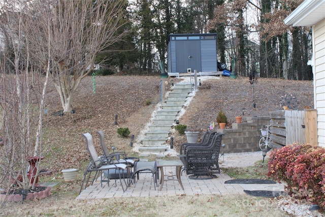 view of yard with a patio area and a storage unit