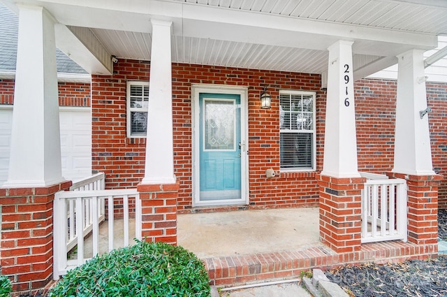 doorway to property featuring covered porch