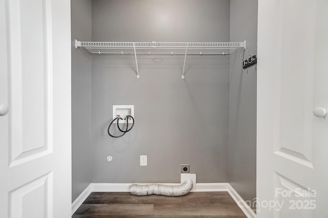 clothes washing area featuring electric dryer hookup, hookup for a washing machine, and hardwood / wood-style flooring