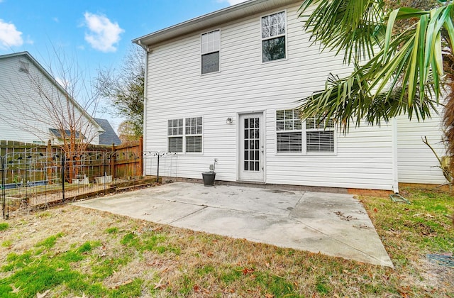 back of house with a patio area