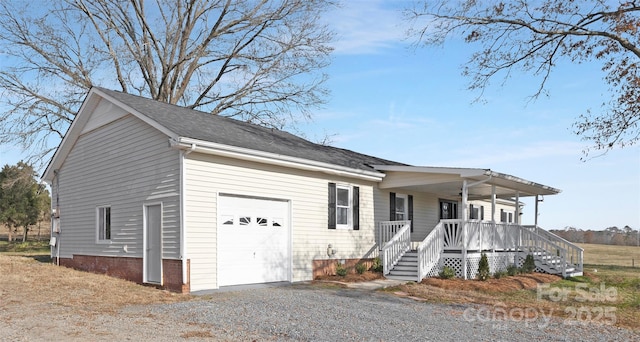 view of front facade with covered porch and a garage