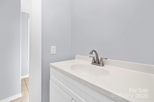 bathroom featuring tile patterned flooring and vanity