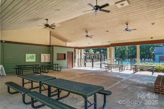 view of patio / terrace with ceiling fan and a community pool