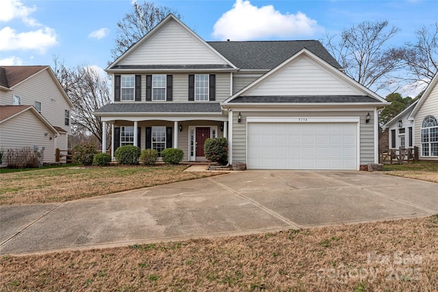 view of front of home with a garage and a front lawn