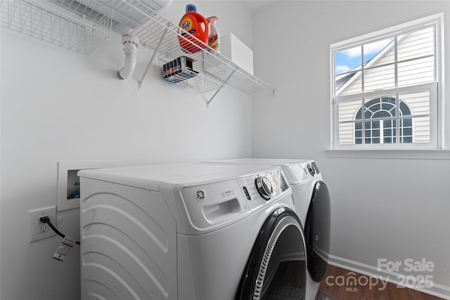 washroom with washer and dryer and dark hardwood / wood-style flooring