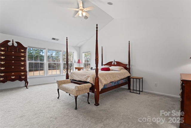 carpeted bedroom with ceiling fan and vaulted ceiling