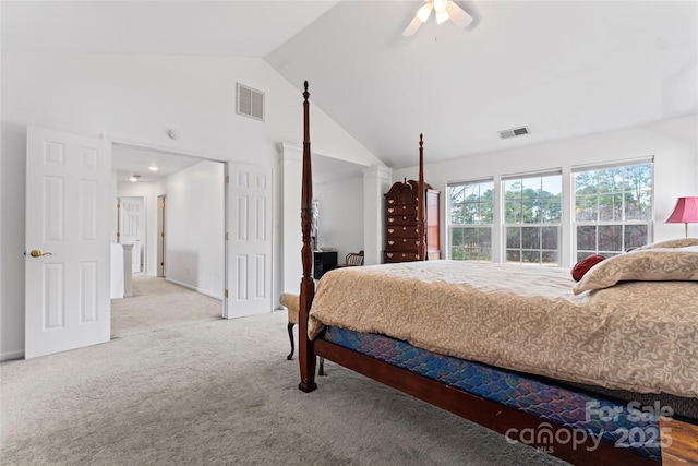 bedroom featuring ceiling fan, light colored carpet, and vaulted ceiling