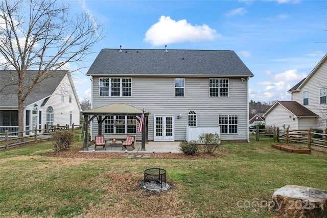 back of property featuring a gazebo, a patio area, and a yard