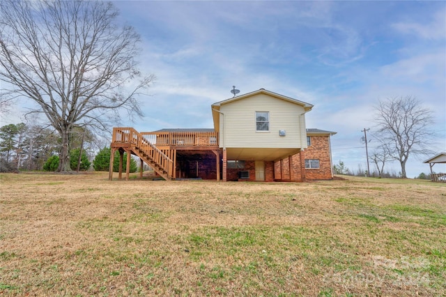 back of house with a lawn and a deck