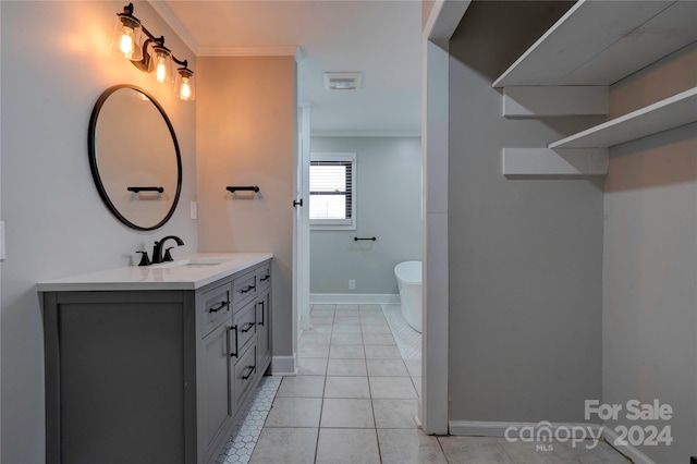 bathroom featuring tile patterned flooring, vanity, toilet, and crown molding