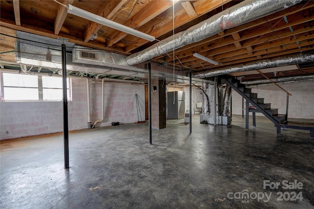 basement with stainless steel refrigerator