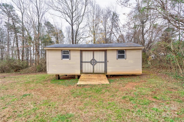 view of outdoor structure with a lawn