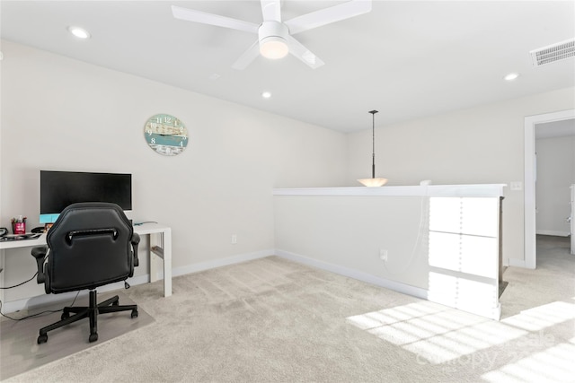 office space with ceiling fan and light colored carpet