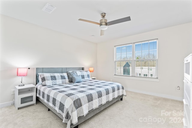 carpeted bedroom featuring ceiling fan