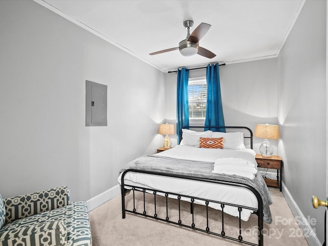 carpeted bedroom with ceiling fan, ornamental molding, and electric panel