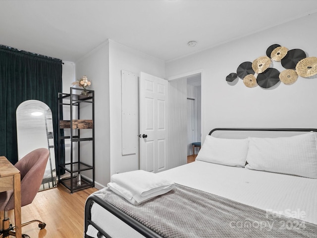 bedroom with light hardwood / wood-style floors