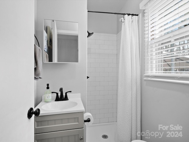 bathroom with vanity and a shower with shower curtain