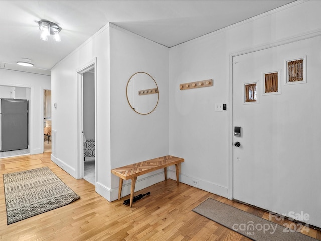 foyer entrance with hardwood / wood-style floors