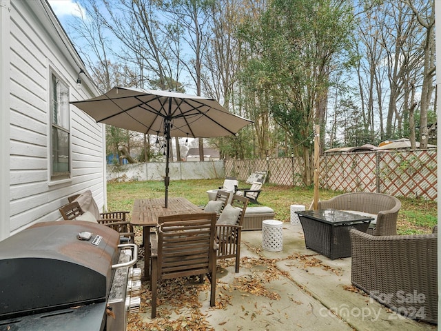 view of patio featuring a grill