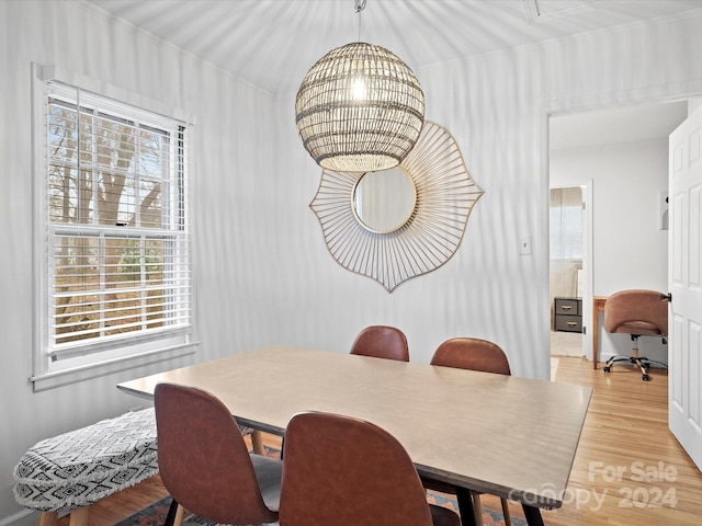 dining room featuring light hardwood / wood-style flooring and a chandelier