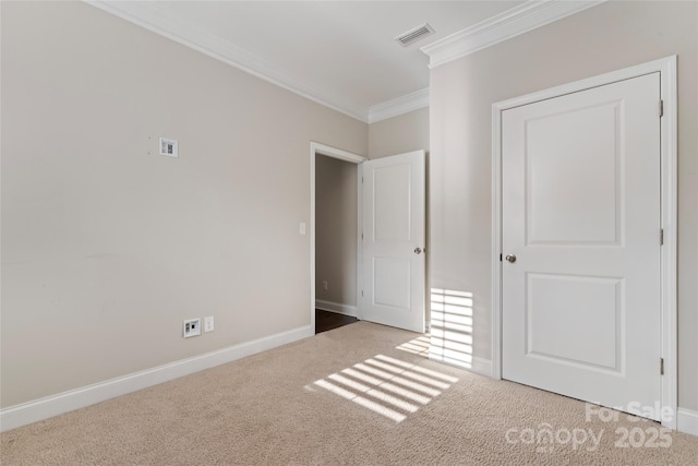 unfurnished bedroom featuring crown molding and light carpet