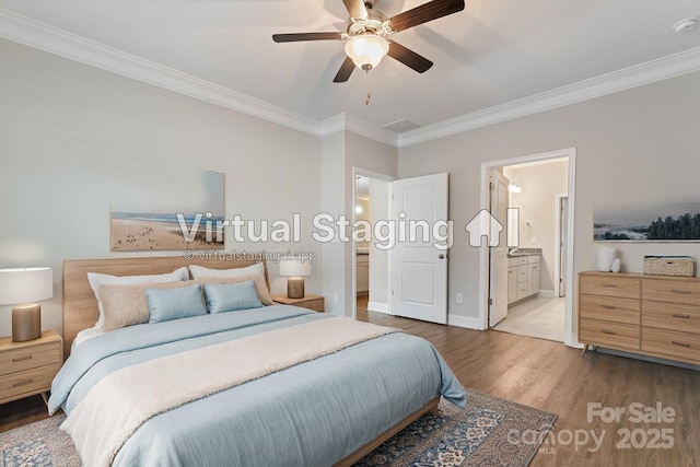 bedroom with connected bathroom, ceiling fan, light hardwood / wood-style floors, and ornamental molding