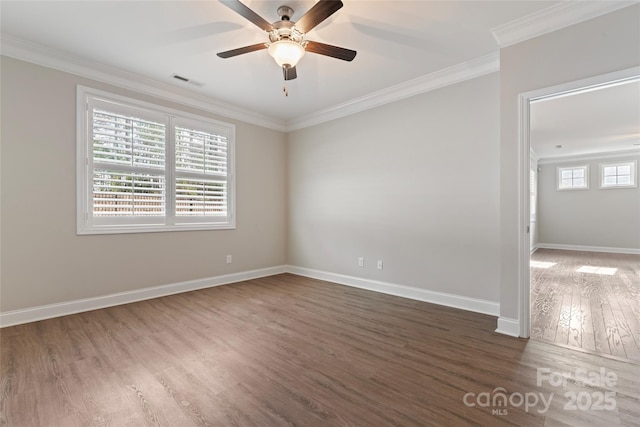 unfurnished room with ceiling fan, dark wood-type flooring, a healthy amount of sunlight, and ornamental molding