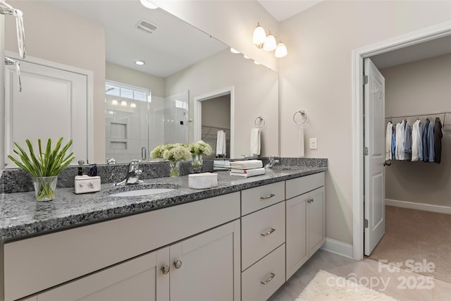 bathroom featuring vanity and walk in shower