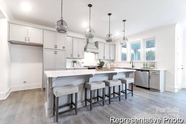 kitchen with a center island, pendant lighting, and appliances with stainless steel finishes