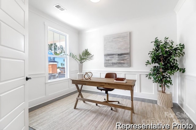 office featuring hardwood / wood-style floors and ornamental molding