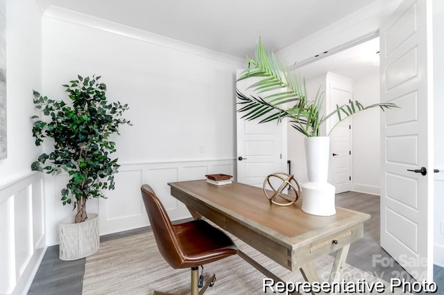 office featuring hardwood / wood-style flooring and crown molding