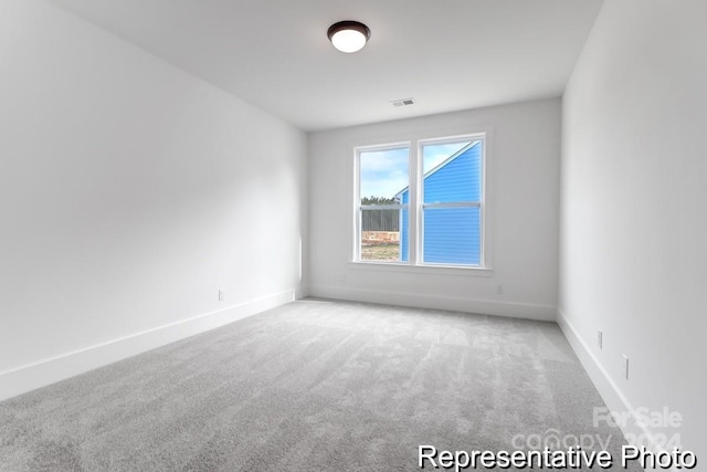 spare room featuring carpet flooring