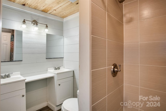 bathroom with vanity, toilet, and wooden ceiling