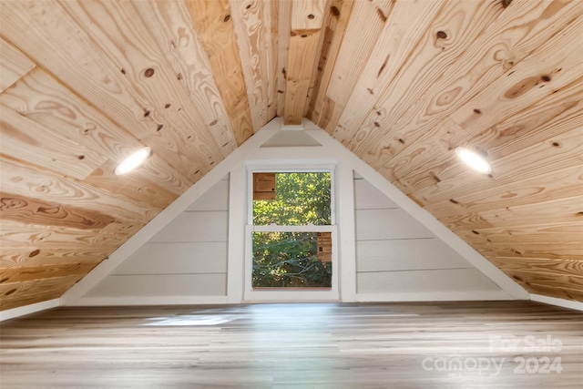 bonus room featuring wood ceiling, vaulted ceiling, and hardwood / wood-style flooring