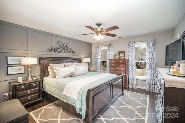 bedroom featuring dark hardwood / wood-style floors and ceiling fan