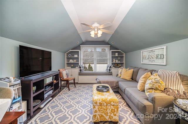 living room featuring ceiling fan and lofted ceiling