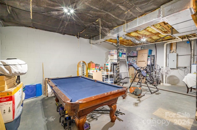 game room with concrete flooring, electric panel, and pool table